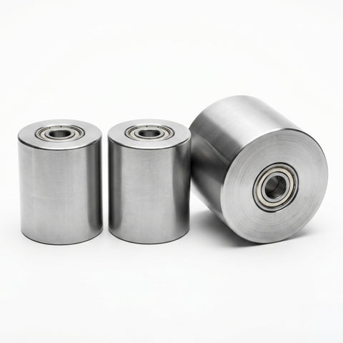 Three metal bearings on a white background