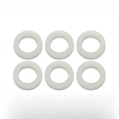 Set of six white circular washers on a white background
